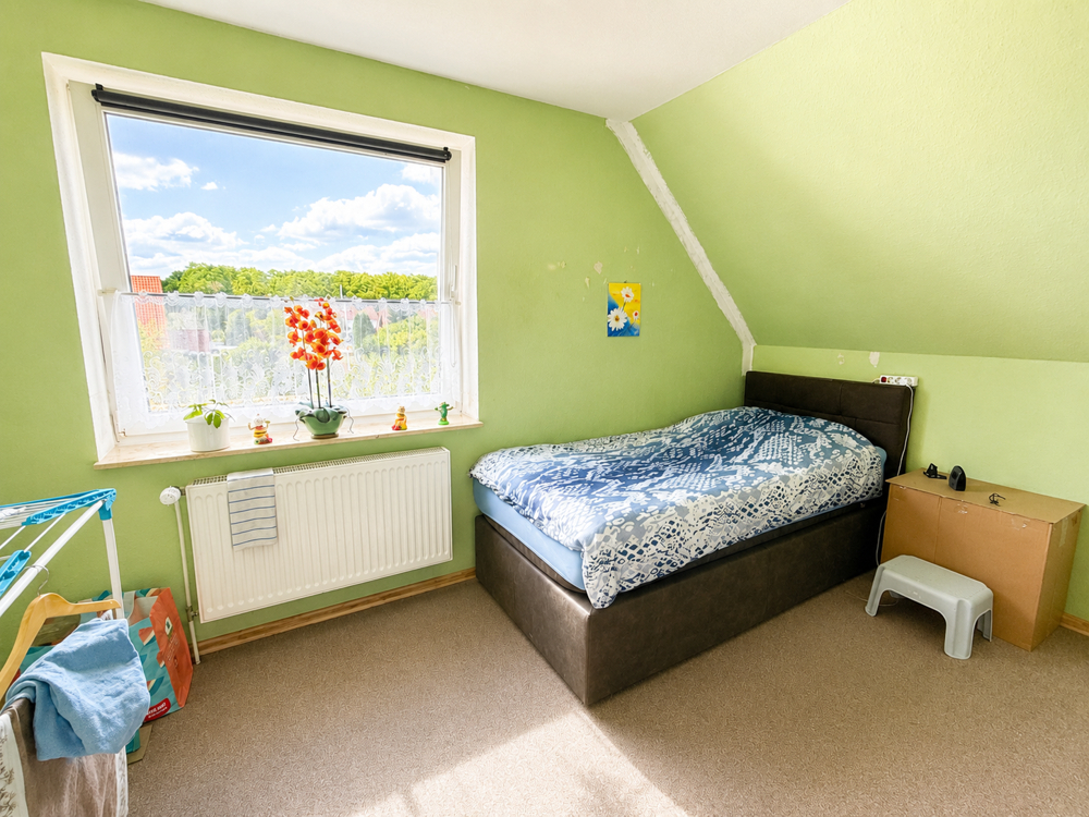 Modernes und gut vermietetes Zweifamilienhaus - Kinderzimmer OG